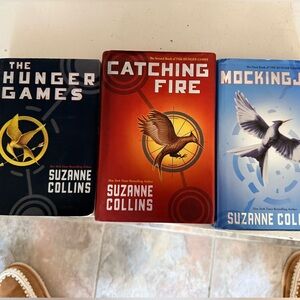 The Hunger Games Trilogy by — Blue, Red, Light Blue Covers